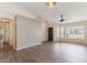 Inviting living room boasts wood-look tile flooring and large windows for natural light at 1061 E Linda Ln, Gilbert, AZ 85234