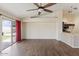 A spacious living room featuring stylish flooring, ceiling fan, and bright natural lighting at 1061 E Linda Ln, Gilbert, AZ 85234