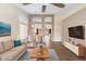 Inviting living room features stylish decor, a dining area, and warm wood flooring at 1061 E Linda Ln, Gilbert, AZ 85234