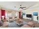 Bright living room boasting neutral furniture, large windows, and backyard access at 1061 E Linda Ln, Gilbert, AZ 85234