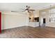Open-concept living area features wood-look tile flooring and a view of the kitchen at 1061 E Linda Ln, Gilbert, AZ 85234