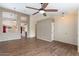 Bright living room features wood-look tile flooring, a ceiling fan, and neutral paint at 1061 E Linda Ln, Gilbert, AZ 85234