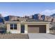 Inviting single-story home boasting a neutral palette, attached two-car garage, and mountain views at 10620 W Sonrisas St, Tolleson, AZ 85353