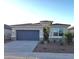 Charming single-story home with a two-car garage, stone accents, and low-maintenance desert landscaping at 10620 W Sonrisas St, Tolleson, AZ 85353