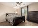Comfortable bedroom with ceiling fan, carpet, and natural light at 12300 N 142Nd Ln, Surprise, AZ 85379
