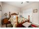 Comfortable bedroom featuring a floral bedspread and a dark wooden frame at 12300 N 142Nd Ln, Surprise, AZ 85379