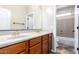 Bathroom featuring double sinks, vanity, and shower with tub at 12473 W Montgomery Rd, Peoria, AZ 85383