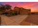 Charming two-story home with an attached two-car garage and low maintenance desert landscaping at 12473 W Montgomery Rd, Peoria, AZ 85383