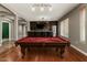 Entertainers dream: Large game room with pool table, wet bar and hardwood floors at 12473 W Montgomery Rd, Peoria, AZ 85383