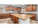 This kitchen features recessed lighting, granite countertops, wood cabinetry, and stainless appliances at 12473 W Montgomery Rd, Peoria, AZ 85383