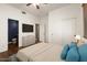 This is a beautifully staged bedroom with a walk-in closet and an en suite bathroom at 12473 W Montgomery Rd, Peoria, AZ 85383