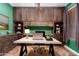 Stylish home office with custom built-ins, desk, and ample storage space for a productive work environment at 12473 W Montgomery Rd, Peoria, AZ 85383