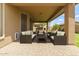 Covered patio with brick flooring and outdoor seating area; perfect for entertaining at 12473 W Montgomery Rd, Peoria, AZ 85383