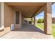 Covered patio with brick flooring, BBQ, and outdoor dining area; perfect for entertaining at 12473 W Montgomery Rd, Peoria, AZ 85383