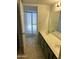 Bathroom features a walk-in shower and a vanity with plenty of storage at 1316 N Spring Cir, Mesa, AZ 85203