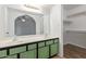 Bathroom features a double sink vanity and shelving for storage at 1316 N Spring Cir, Mesa, AZ 85203