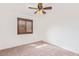 Bright bedroom with carpet, a window with brown shutters and a ceiling fan at 1316 N Spring Cir, Mesa, AZ 85203