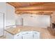 Bright kitchen featuring granite counters, modern appliances, and brick fireplace at 1316 N Spring Cir, Mesa, AZ 85203