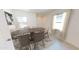 The dining room is brightly lit and features neutral colors with a decorative rug under the dining table at 13226 E Verbina Ln, Florence, AZ 85132