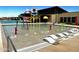 Interactive splash pad area offers colorful water features and lounge chairs for relaxation at 13226 E Verbina Ln, Florence, AZ 85132