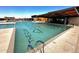 Resort-style swimming pool features clear water, lane markers, and comfortable lounging areas at 13226 E Verbina Ln, Florence, AZ 85132