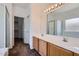 Bathroom features a double sink vanity, glass enclosed shower, and a walk in closet at 13337 W Evans Dr, Surprise, AZ 85379