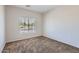 Bedroom with neutral walls, carpet, and a window with blinds at 13337 W Evans Dr, Surprise, AZ 85379