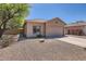 Inviting single-story home with low-maintenance landscaping and a two-car garage at 13337 W Evans Dr, Surprise, AZ 85379