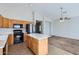 Well-lit kitchen featuring modern appliances and a convenient island at 13337 W Evans Dr, Surprise, AZ 85379