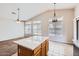 Open kitchen and dining area with island and great natural light at 13337 W Evans Dr, Surprise, AZ 85379