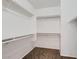 Walk-in closet features white shelving and carpet at 13337 W Evans Dr, Surprise, AZ 85379