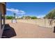 Large backyard featuring desert landscaping, privacy fence, and storage shed at 13414 W Maui Ln, Surprise, AZ 85379