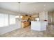 Sunlit kitchen with a breakfast bar perfect for entertaining guests at 13414 W Maui Ln, Surprise, AZ 85379
