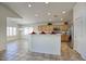 Open kitchen and dining area featuring modern appliances, ample cabinet space, and recessed lighting at 13414 W Maui Ln, Surprise, AZ 85379
