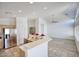 Modern kitchen featuring stainless steel appliances, granite countertops, and an open concept layout at 13414 W Maui Ln, Surprise, AZ 85379