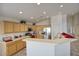 Bright kitchen featuring stainless steel appliances and ample counter space at 13414 W Maui Ln, Surprise, AZ 85379