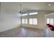 Open living room with vaulted ceilings, lots of natural light, and views to the kitchen at 13414 W Maui Ln, Surprise, AZ 85379