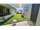 Lush backyard with artificial turf, shade, and recreational space, perfect for Gathering fun and entertaining at 1520 W Encanto Blvd, Phoenix, AZ 85007