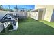 Well-maintained backyard with a playhouse, trampoline, and artificial turf, ideal for outdoor activities and leisure at 1520 W Encanto Blvd, Phoenix, AZ 85007