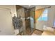 Bathroom featuring a shower with tile surround, glass doors, and modern fixtures at 1520 W Encanto Blvd, Phoenix, AZ 85007