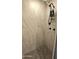 Tiled shower stall with upgraded shower head and product storage at 1520 W Encanto Blvd, Phoenix, AZ 85007