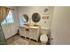 Bathroom featuring dual sinks, granite countertops, and tile floors at 1520 W Encanto Blvd, Phoenix, AZ 85007