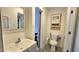 Neutral bathroom with sink, toilet, and plenty of cabinet space at 1520 W Encanto Blvd, Phoenix, AZ 85007