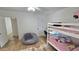Bright bedroom featuring a bunk bed, desk, and cozy beanbag chair, perfect for or guests at 1520 W Encanto Blvd, Phoenix, AZ 85007