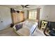 Bright bedroom featuring large window, ceiling fan, and plenty of storage space at 1520 W Encanto Blvd, Phoenix, AZ 85007