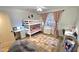 Bright bedroom featuring a bunk bed, desk, and cozy beanbag chair, perfect for or guests at 1520 W Encanto Blvd, Phoenix, AZ 85007