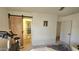 Bright bedroom adjacent to sliding barn door and bathroom, with workout equipment at 1520 W Encanto Blvd, Phoenix, AZ 85007