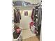 Organized closet space with shelving and hanging racks for efficient storage of clothing and accessories at 1520 W Encanto Blvd, Phoenix, AZ 85007