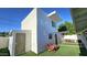 Charming home exterior with well-kept backyard, featuring artificial turf, patio seating, and a shade structure at 1520 W Encanto Blvd, Phoenix, AZ 85007