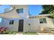Exterior of home with private entrance, outdoor seating, and artificial turf for low-maintenance living at 1520 W Encanto Blvd, Phoenix, AZ 85007